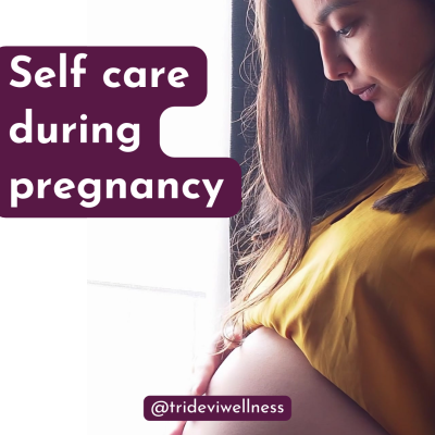 Pregnant woman holding belly