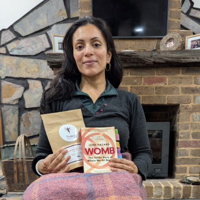 Sanjukta peristeaming and holding herb pouch and Womb book